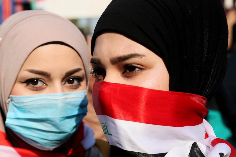 Iraqi women take part in anti-government protests in Tahrir Square, Baghdad. AP