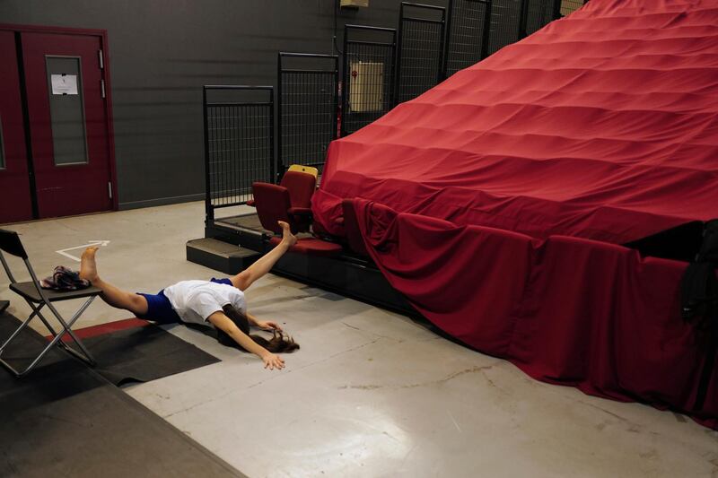 Dancer Lucille Chalopin, from Paris, of the Eolienne company stretches prior to performing "Le Lac des Cygnes". AP Photo