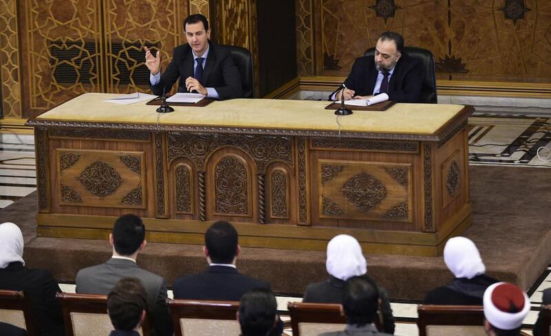 Syrian president Bashar Al Assad speaks during a meeting with the youth religious team, in Damascus on February 15, 2017 as minister of Awqaf Mohammad Abdul-Sattar Al Sayyed looks on. Sana/ EPA