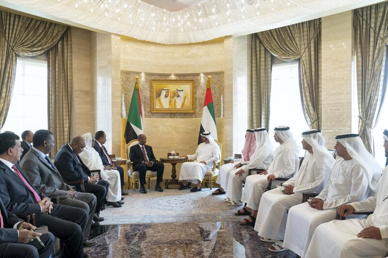 ABU DHABI, UNITED ARAB EMIRATES - October 08, 2019: HH Sheikh Mohamed bin Zayed Al Nahyan, Crown Prince of Abu Dhabi and Deputy Supreme Commander of the UAE Armed Forces (back R), meets with General Abdel Fattah Al Burhan, Chairman of Sudan's Sovereign Council (back L), at Al Shati Palace. Seen with HE Jassem Mohamed Bu Ataba Al Zaabi, Chairman of Abu Dhabi Executive Office and Abu Dhabi Executive Council Member (R), HE Ali Mohamed Hammad Al Shamsi, Deputy Secretary-General of the UAE Supreme National Security Council (2nd R), HH Sheikh Abdullah bin Zayed Al Nahyan, UAE Minister of Foreign Affairs and International Cooperation (3rd R), HH Sheikh Mansour bin Zayed Al Nahyan, UAE Deputy Prime Minister and Minister of Presidential Affairs (2nd R) and HH Sheikh Tahnoon bin Zayed Al Nahyan, UAE National Security Advisor (4th R). 

( Mohamed Al Hammadi / Ministry of Presidential Affairs )
---