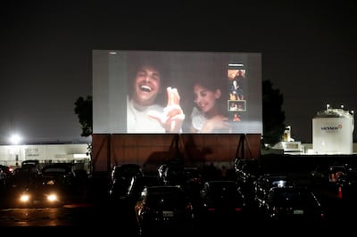 Director Dave Franco and cast member Alison Brie react as they take part in a Q&A session via Zoom from a vehicle after an advanced screening for the movie "The Rental" at the Vineland Drive-In movie theater in City of Industry, California, U.S. June 18, 2020. REUTERS/Mario Anzuoni