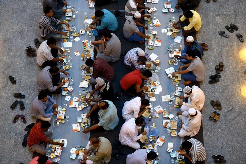 Saudi and foreign Muslims break their fast during the holy month of Ramadan at Turki bin Abdulaziz grand mosque in Riyadh, Saudi Arabia.  Fayez Nureldine / AFP