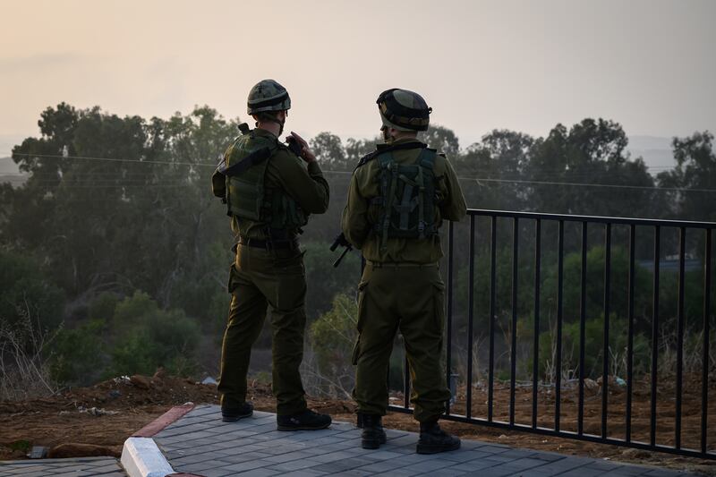 Israeli soldiers look out towards Gaza – but whether they are sizing up a full-scale ground incursion remains to be seen. Getty Images