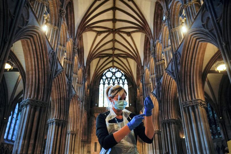 LICHFIELD, ENGLAND - FEBRUARY 26: A nurse draws up a vaccine as members of the public receive their Covid-19 vaccinations at Lichfield Cathedral, Staffordshire on February 26, 2021 in Lichfield, England. Lichfield Cathedral is one of many unusual venues that have been adapted for administering vaccines during the Covid-19, coronavirus pandemic. Over 19 million people in the United Kingdom have had their first Covid-19 vaccination, including 90 percent of over-70s.  (Photo by Christopher Furlong/Getty Images)