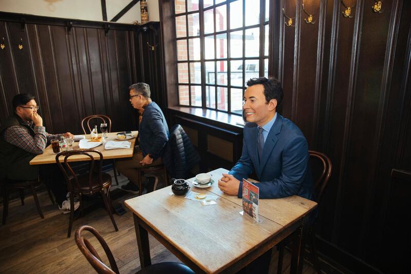 A wax statue of comedian Jimmy Fallon occupies a table at Peter Luger Steak House. AP Photo