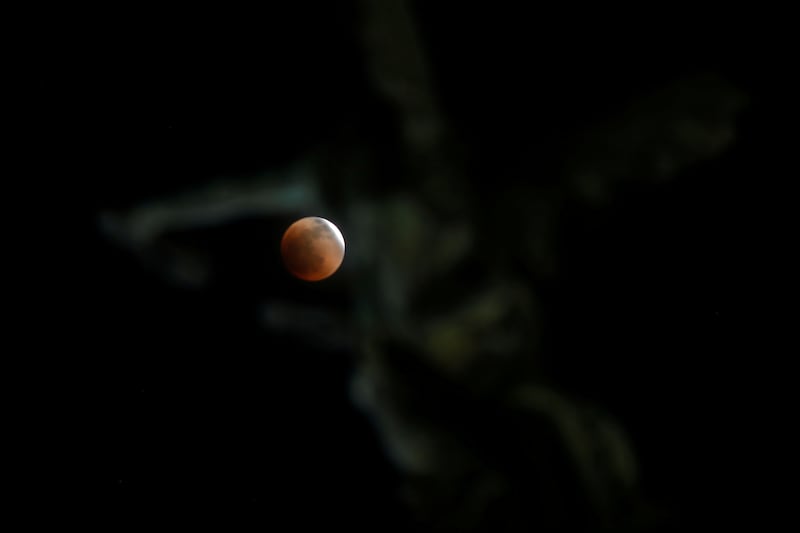A full Moon moves through the shadow of the Earth in San Salvador, El Salvador. Reuters