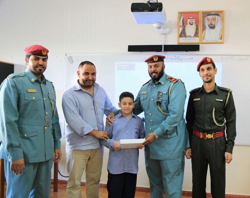 Civil Defence honour Abdallah Mohammed Abu Zahra who used his smarts to help a trapped brother and sister by taking a screwdriver and using it to prise open the door of the lift at his residential building. Courtesy Ajman Civil Defence