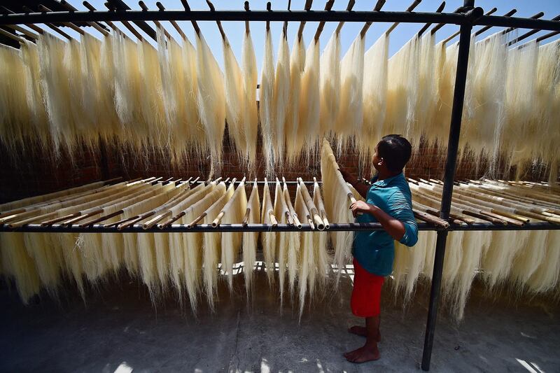 Vermicelli is prepared at a factory in Allahabad, northern India. The pasta threads are often used in a sweet dish that is popular during Ramadan. AFP