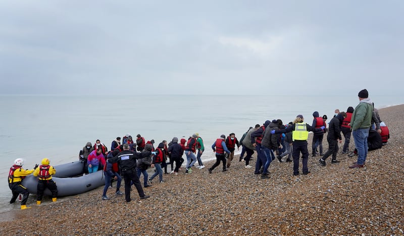 A group of people thought to be migrants are brought ashore in Kent. PA