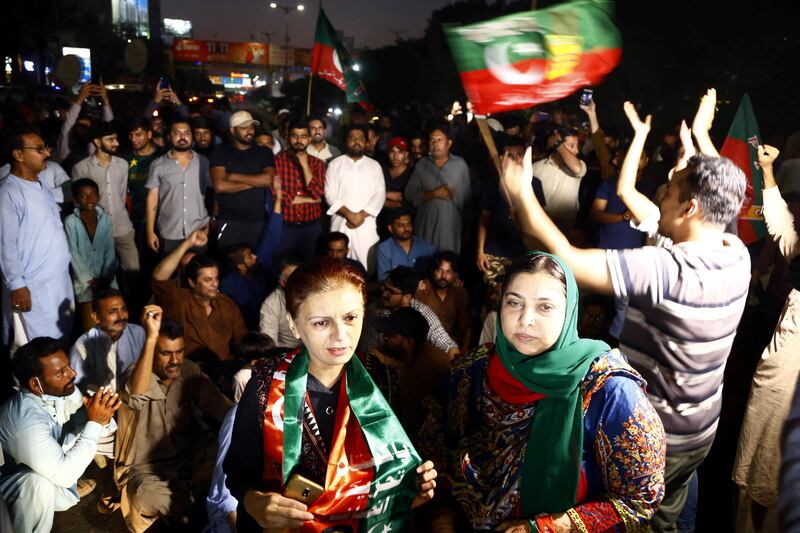 Khan supporters in Karachi react following the shooting incident in Wazirabad. Reuters