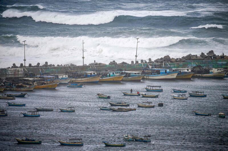 High waves batter the fishing port in Gaza City during a storm. AFP