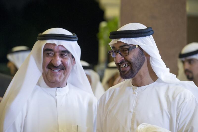 Sheikh Mohammed bin Zayed, Crown Prince of Abu Dhabi and Deputy Supreme Commander of the Armed Forces, right, speaks with Sheikh Saud bin Rashid Al Mu’alla, Ruler of Umm Al Quwain. Ryan Carter / Crown Prince Court - Abu Dhabi