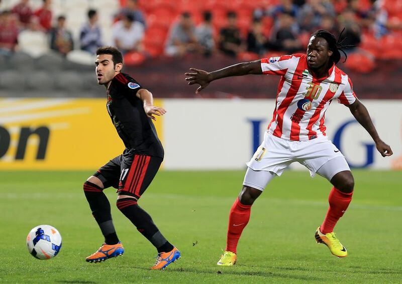 Felipe Caicedo, right, pictured during an Asian Champions League match against Al Rayyan of Qatar on February 25, 2014, will be among five key players absent from Al Jazira's squad when they host city rival Al Wahda in the UAE League Cup on Sunday. Ravindranath K / The National