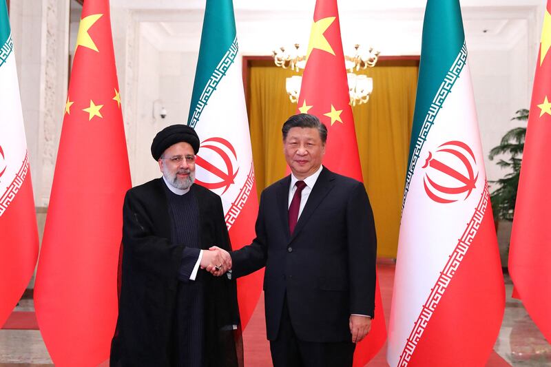 Chinese President Xi Jinping welcomes Iranian President Ebrahim Raisi during his visit to Beijing. AFP