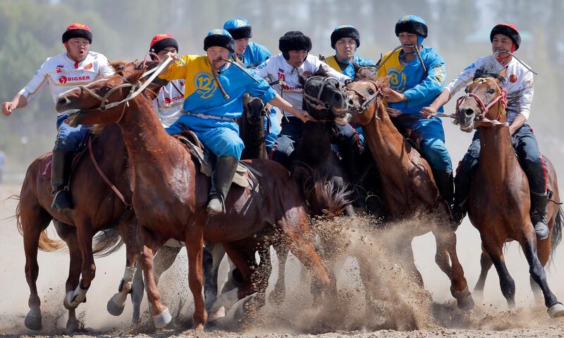 Kazakh and Russian horsemen take part in the traditional Central Asian sport of kok-boru (goat dragging). EPA