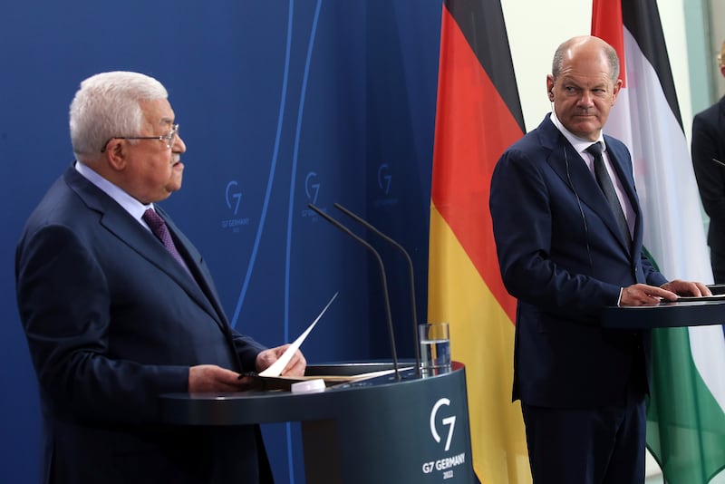 Palestinian President Mahmoud Abbas, left, speaks during his news conference with German Chancellor Olaf Scholz. AP