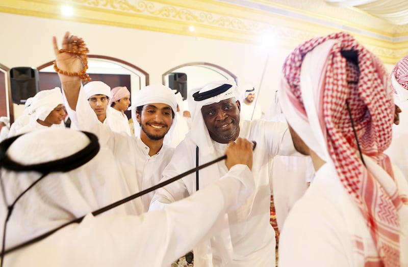 ABU DHABI , UNITED ARAB EMIRATES - JULY 5 : Bilal Antara Shadah Al Mazrouei ( center right ) dancing with the guests during the local marriage celebration at Baniyas wedding hall in Abu Dhabi.  ( Pawan Singh / The National ) Story by Haneen Dajani