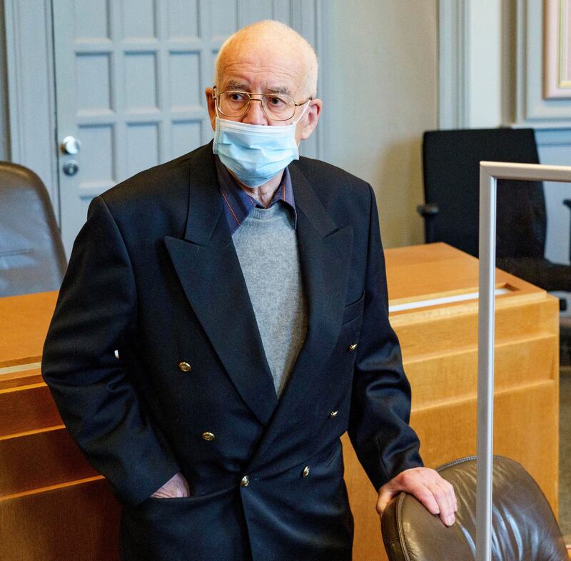 An 84-year-old man, accused of possession of a tank, waits in the courtroom for the start of his trial in Kiel, Germany. AP