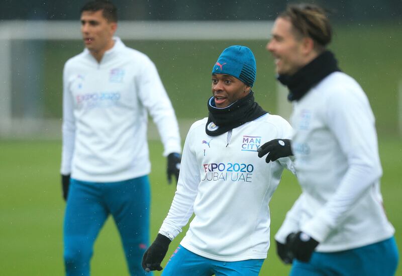Manchester City's Rodri, left, Raheem Sterling, centre, and Jack Grealish train on Tuesday. AFP