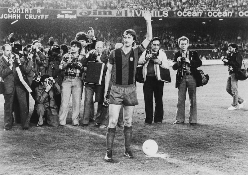 Photographers gather around the halfway line as Johan Cruyff waves farewell to the fans before his final game for Barcelona against former club Ajax on 28th May 1978 at the Camp Nou football stadium in Barcelona, Spain. Getty Images
