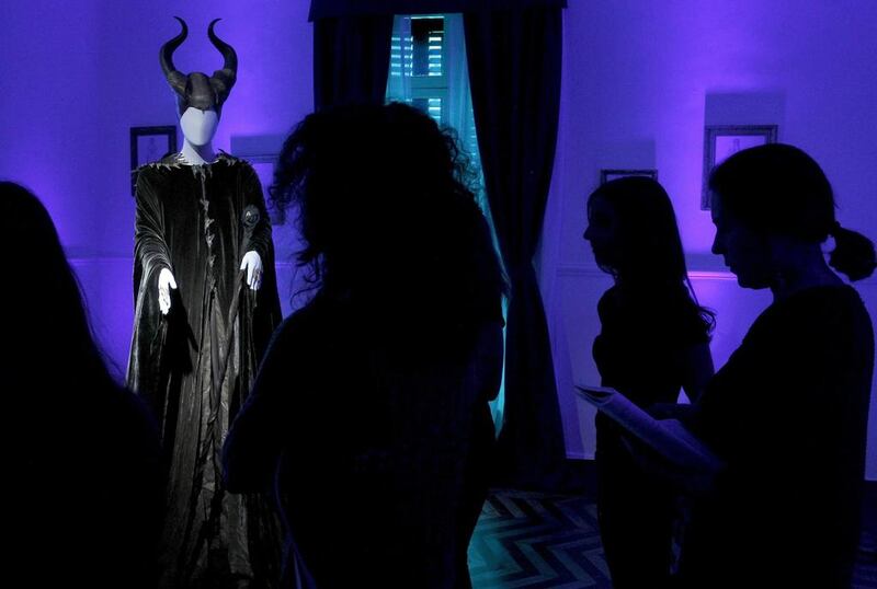 Visitors look at one of the dresses at 'Maleficient, the exhibition' at the Santa Barbara Palace in Madrid, Spain. The exhibition runs from 10 to 18 May.  EPA