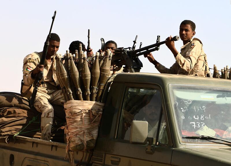 Sudanese soldiers from the Rapid Support Forces unit which led by Gen. Mohammed Hamdan Dagalo, the deputy head of the military council, patrol during a rally for Dagalo, in Garawee town, north of Sudan.  AP