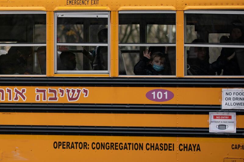 A boy looks out the window of a school bus in the Brooklyn borough of New York City. Reuters