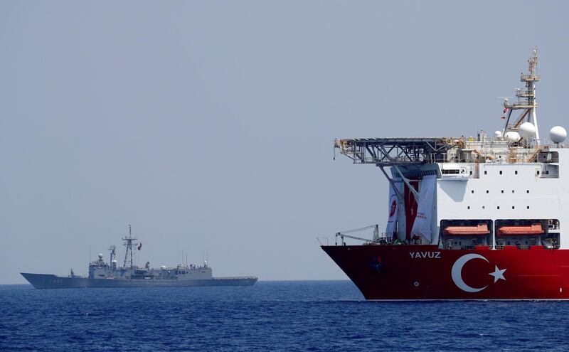 FILE PHOTO: The Turkish drilling vessel Yavuz is seen being escorted by a Turkish Navy frigate in the eastern Mediterranean off Cyprus, August 6, 2019. REUTERS/Murad Sezer/File Photo