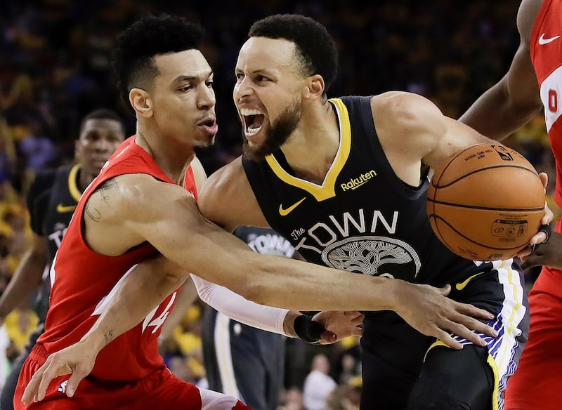 Golden State Warriors guard Stephen Curry, right, is defended by Toronto Raptors guard Danny Green during the second half of Game 4 of basketball's NBA Finals Friday, June 7, 2019, in Oakland, Calif. (AP Photo/Ben Margot)