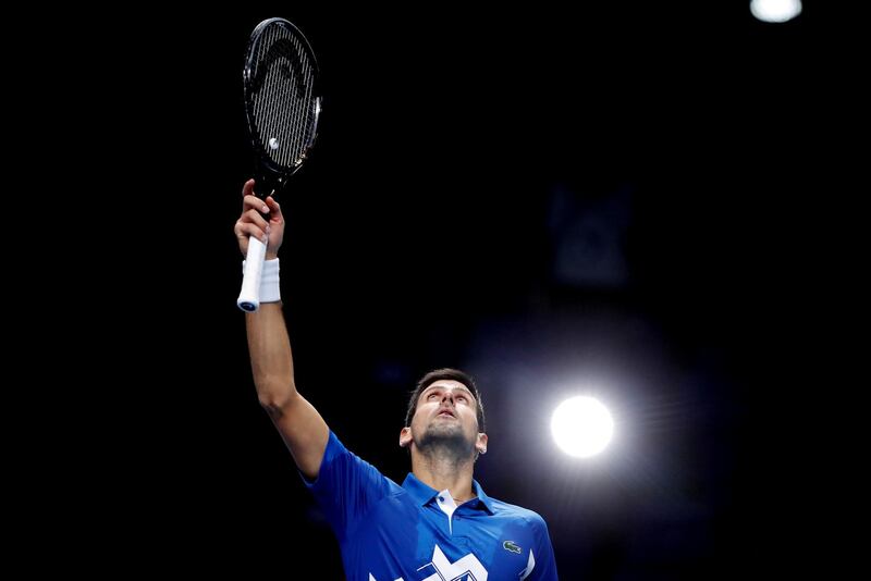 Novak Djokovic celebrates winning his group stage match. Reuters