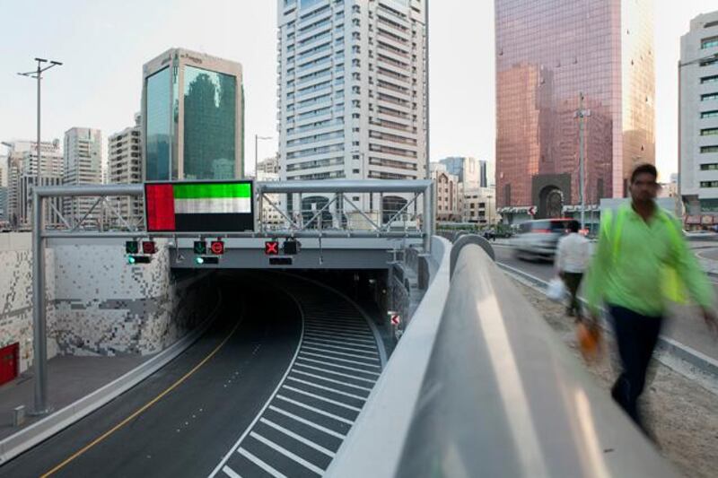 Abu Dhabi, United Arab Emirates, December 04, 2012:  
Traffic downtown Abu Dhabi still bypasses the new Salam Tunnel on Tuesday evening, Dec. 4, 2012, as the cars trail above ground around it. Traffic at the tunnel is set to open at 6am the following day.   Silvia Razgova / The National


