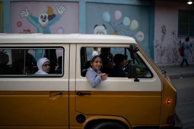 Children arrive to an UNRWA school for the first day of a new school year in Gaza City, Wednesday, Aug. 29, 2018. Hundreds of thousands of Palestinian children are starting their school year in the Gaza Strip amid a major budget crunch for the United Nations agency that funds many schools. (AP Photo/Felipe Dana)