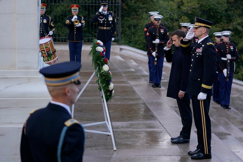 Mr Macron pauses after laying a wreath at the Tomb of the Unknown Soldier. AP