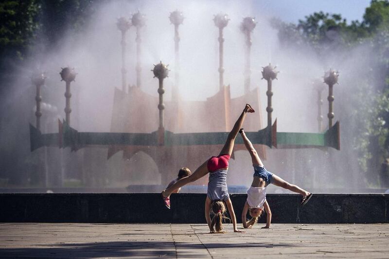 Girls play in a park in the eastern Ukrainian city of Lugansk. Dimitar Dilkoff / AFP Photo