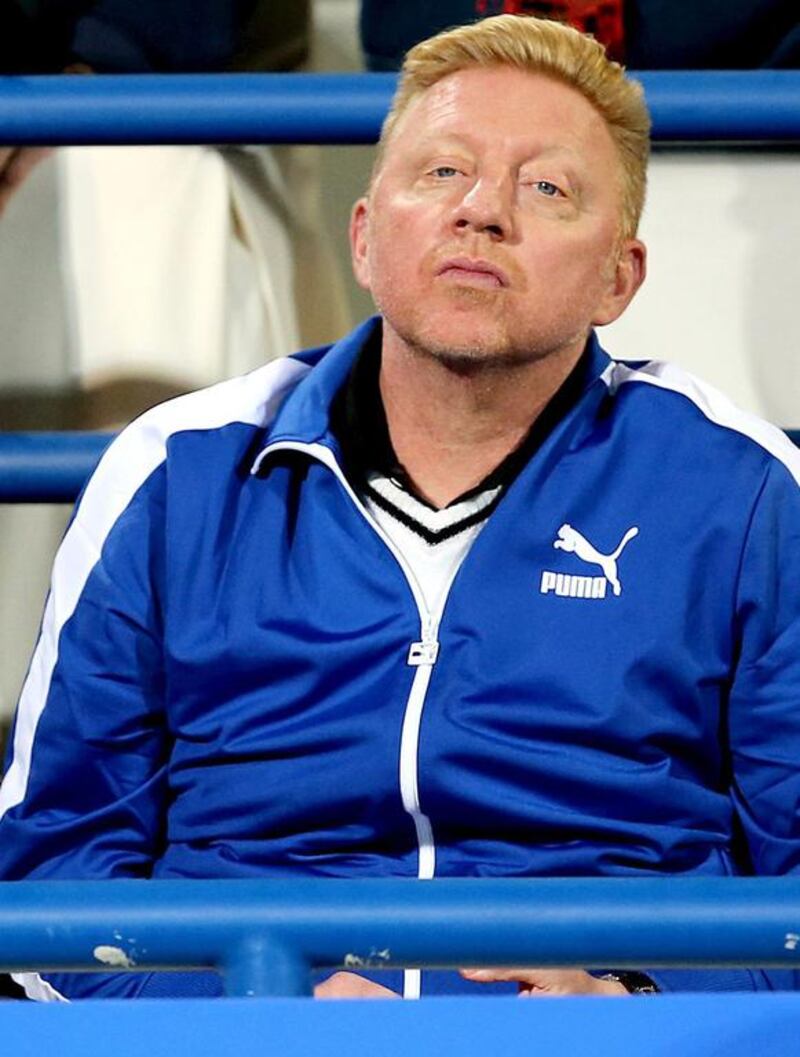 Former world No 1 tennis player from Germany, Boris Becker, watches during the semi-final match between Novak Djokovic and Jo-Wilfried Tsonga at the Mubadala World Tennis Championship in Abu Dhabi on Friday. Becker is the new head coach of Djokovic and makes his first appearance as such in Abu Dhabi. Ali Haider / EPA