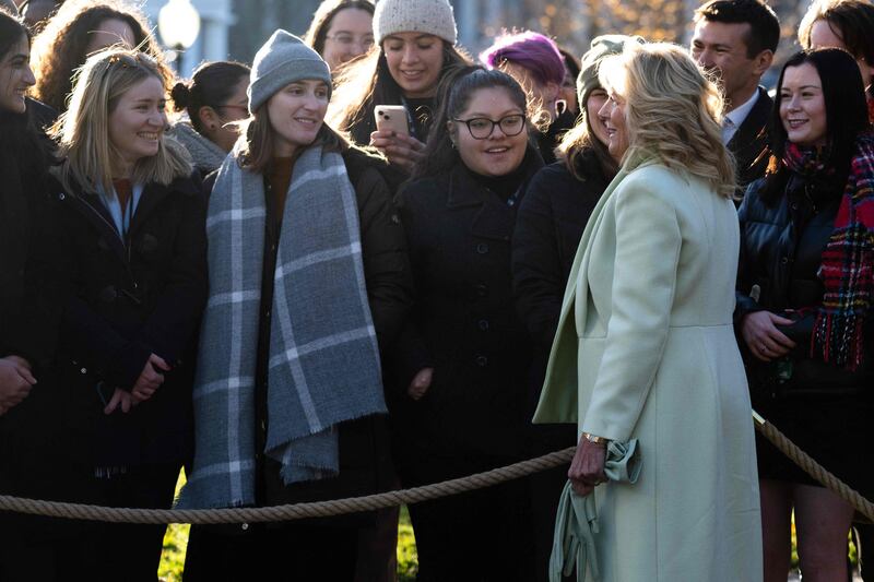 Ms Biden greets volunteers who will decorate the White House for Christmas. AFP