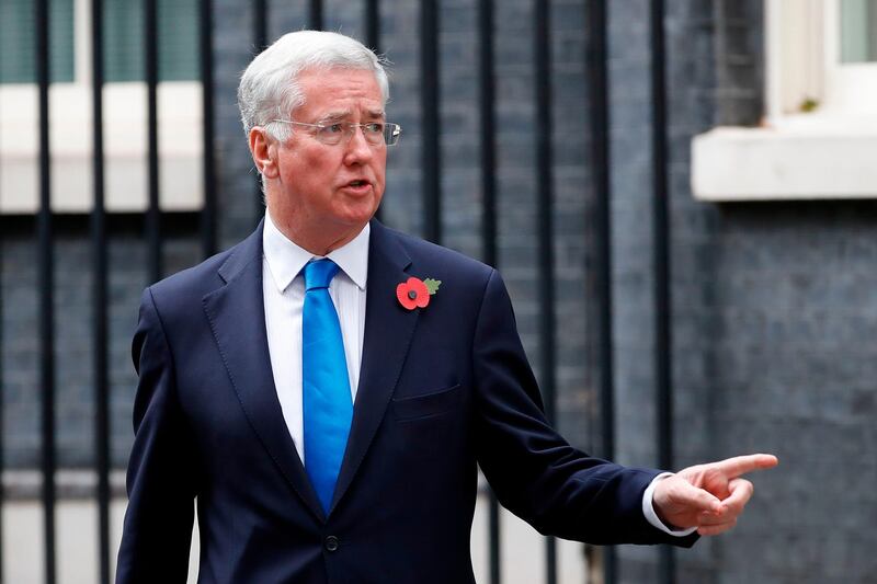 Britain's Defence Secretary Michael Fallon leaves 10 Downing Street after the weekly meeting of the cabinet in central London on October 31, 2017. / AFP PHOTO / Tolga AKMEN