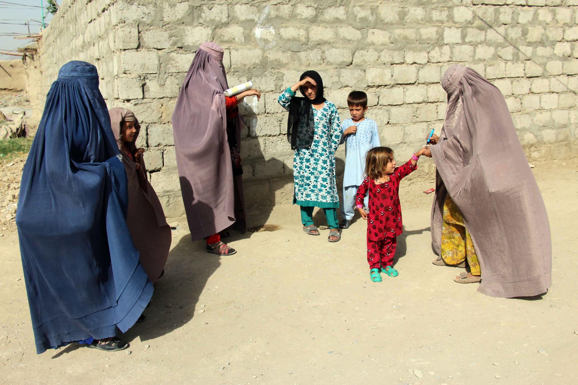 Health workers administer Polio vaccination to children in Kandahar, Afghanistan. EPA