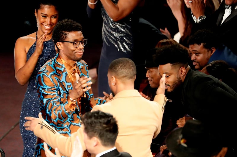 Chadwick Boseman embraces Michael B Jordan at the 50th NAACP Image Awards. Reuters