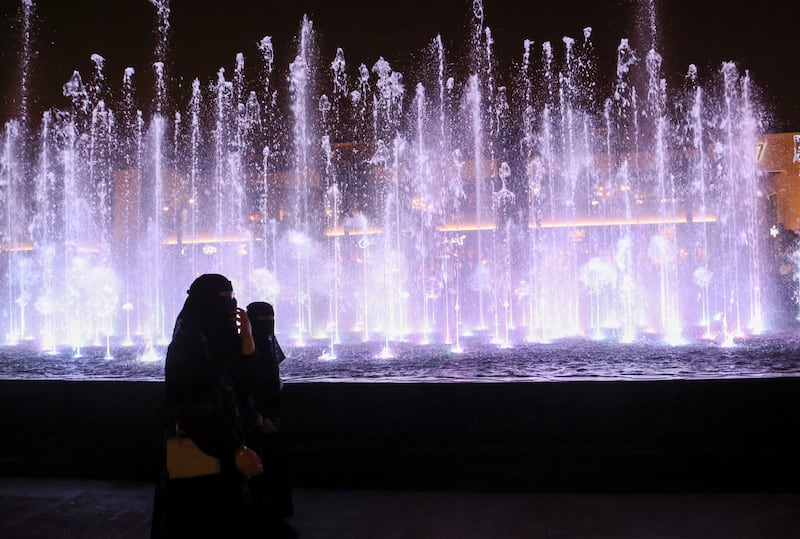 Women walk past fountain in Riyadh. The kingdom aims to increase the tourism sector’s contribution to its economy under the Vision 2030 programme. Reuters