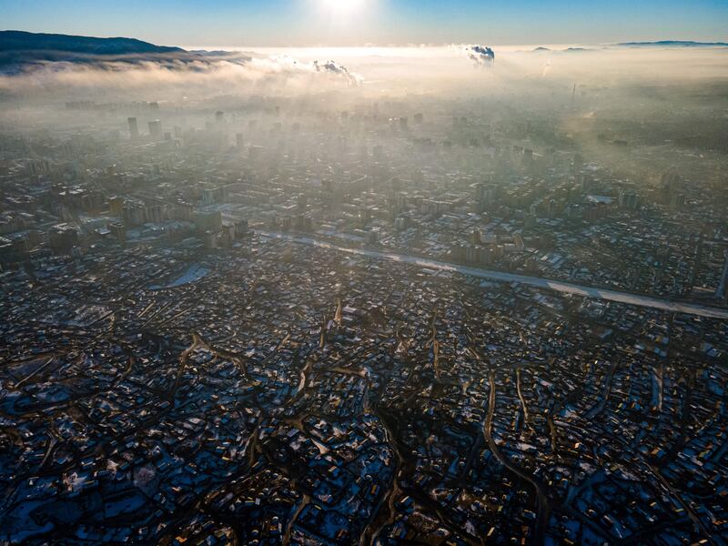 Smog hangs over houses on a polluted day in Ulaanbaatar, the capital of Mongolia. AFP