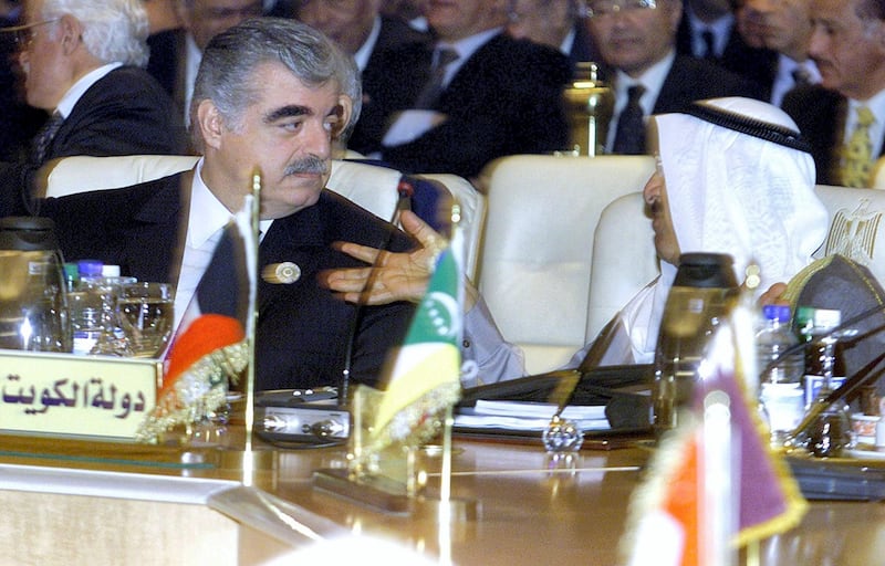 Lebanese Prime Minister Rafiq Hariri (L) talks with Kuwait's deputy premier and foreign minister, Sheikh Sabah al-Ahmad al-Sabah, during the openning session of the Arab leader's summit at the Egyptian Red Sea resort of Sharm el-Sheikh 01 March 2003.  AFP PHOTO/Marwan NAAMANI (Photo by MARWAN NAAMANI / AFP)