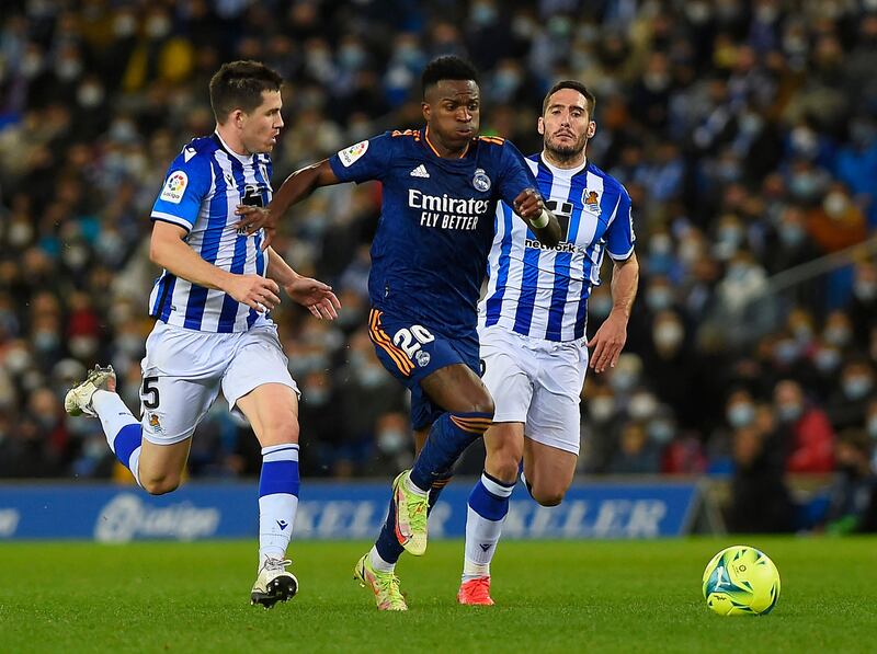 Real Madrid's Brazilian forward Vinicius Junior is challenged by Real Sociedad's Spanish midfielder Igor Zubeldia.  AFP