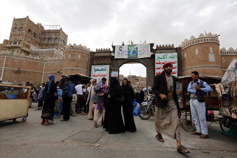 epa06756372 Yemenis walk through the gate of Bab al-Yaman on the 28th anniversary of the unification of North and South Yemen, in the old quarter of Sana'a, Yemen, 22 May 2018. Yemen marks the 28th anniversary of the unification 22nd May 1990 of North and South Yemen as the Houthi militias and their tribal allies continue to consolidate their grip over large parts of northern Yemen, including the capital Sanaâ€™a, while Yemenâ€™s internationally recognized government forces and Saudi-led coalition backed southern militias control southern Yemen.  EPA/YAHYA ARHAB