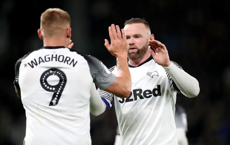 Derby County's Martyn Waghorn, celebrates with Wayne Rooney after scoring his side's second goal. PA