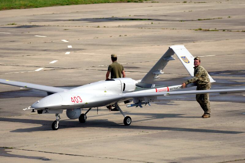 Ukrainian servicemen push a Bayraktar TB2 drone, an aircraft that has proved successful in the defending the skies against Russia. Getty Images