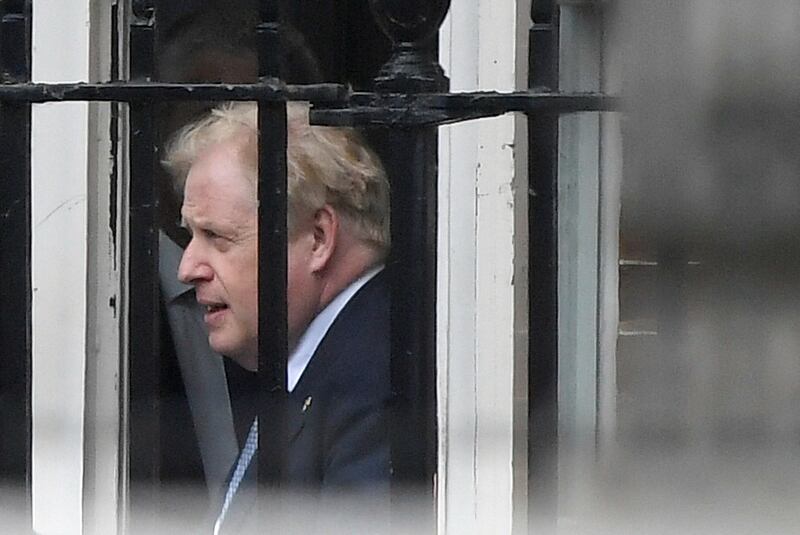 Boris Johnson leaves from the back entrance of No 10 Downing Street. Reuters