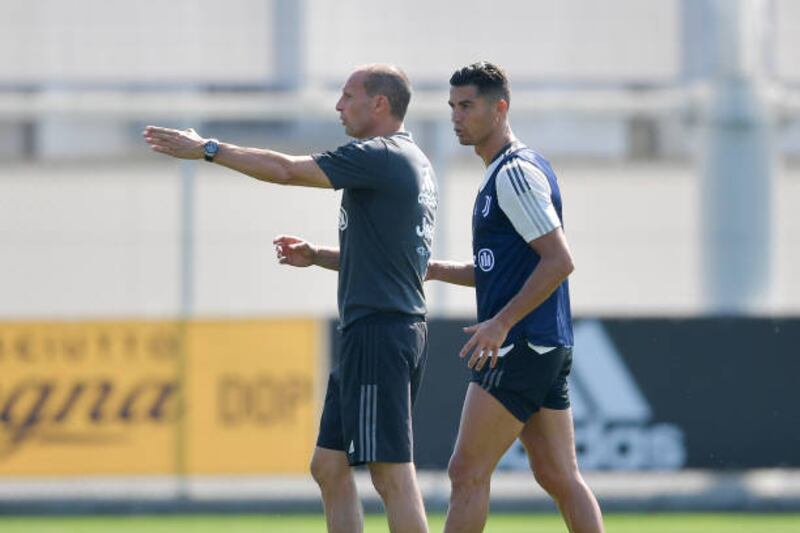 Juventus coach Massimiliano Allegri with Cristiano Ronaldo during training in Turin.