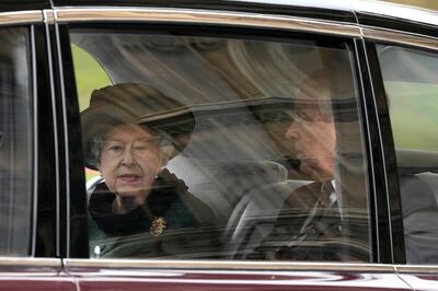 Britain's Queen Elizabeth II and her son Prince Andrew were taken to the service by limousine. AP.