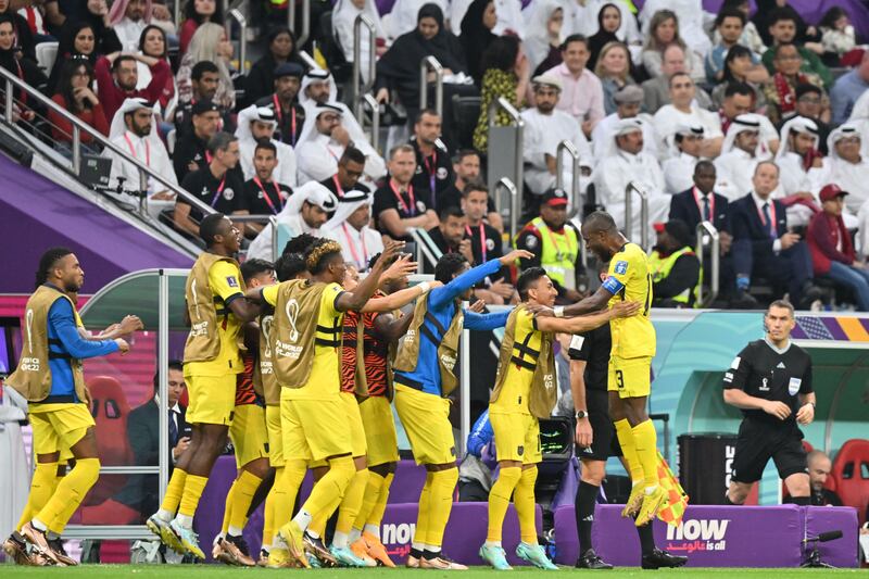 Enner Valencia (R) celebrates with teammates after the second. AFP